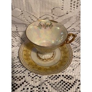 1921 to 1941 Nippon Topline iridescent pedestal gold trim tea cup and saucer.